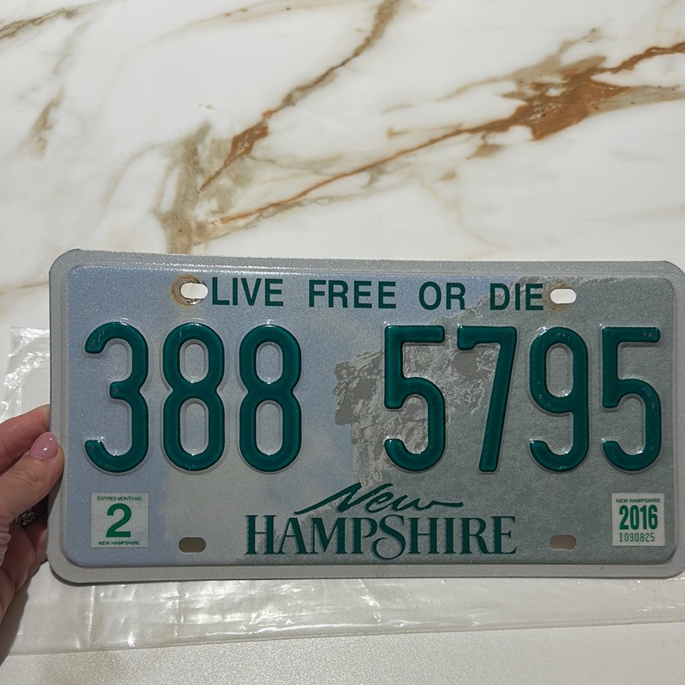 New Hampshire License Plate with Green Text